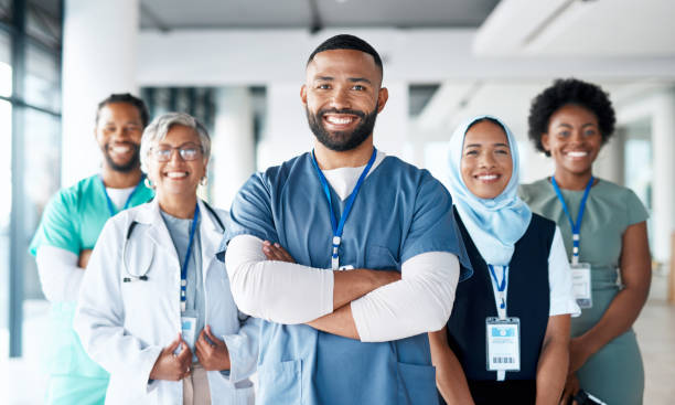 Healthcare, portrait and team of doctors in the hospital standing after a consultation or surgery. Success, confidence and group of professional medical workers in collaboration at a medicare clinic.